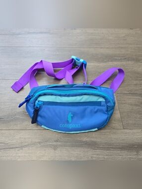 Cotapaxi Kapai 1.5L Hip Pack in the "Del Día" Style Blue Purple Hiking Travel